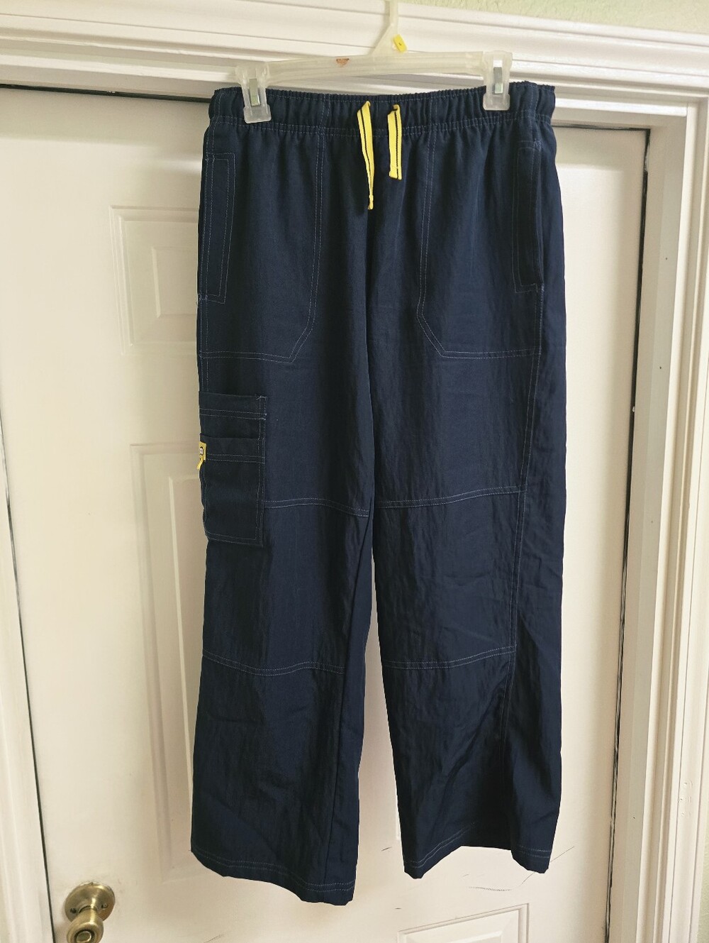 2 Pair Of Navy Cargo Uniform Pants with Yellow Drawstring. Size Large Petite.